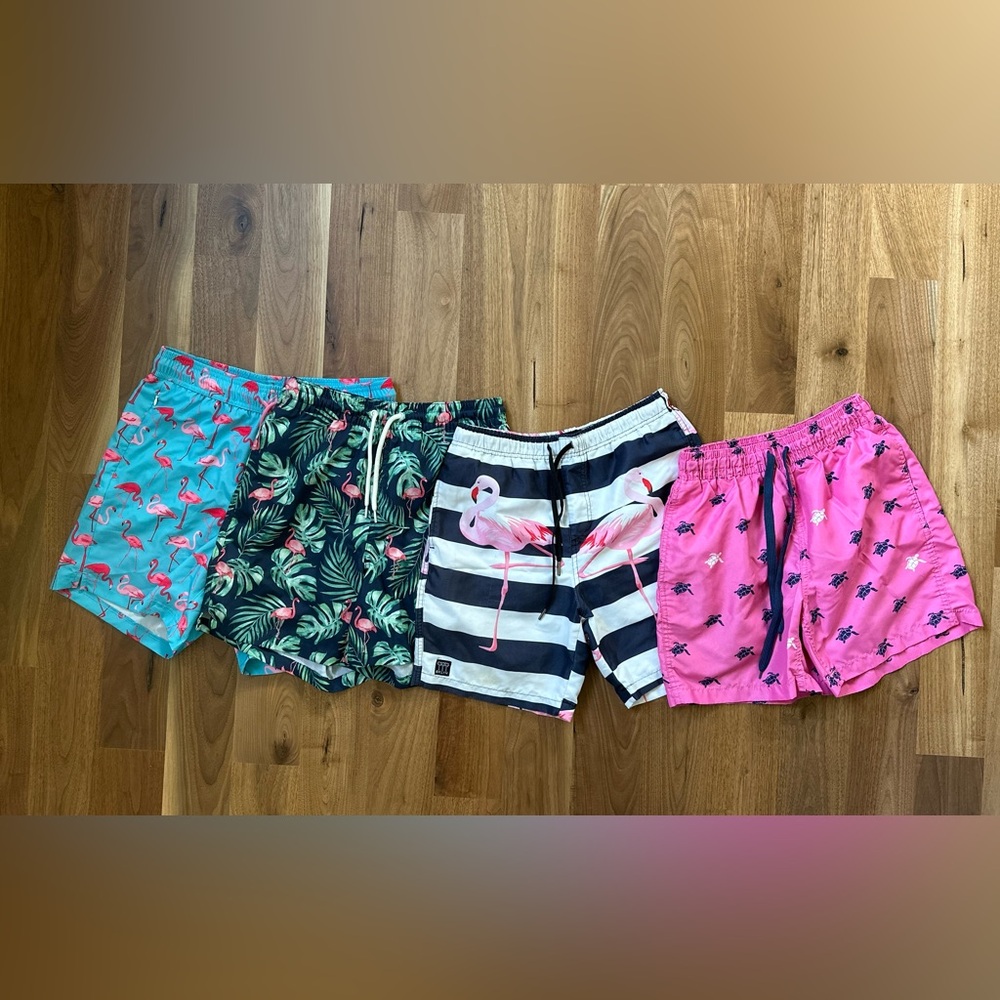 Bundle of 4 men’s swim trucks. 3 are a size S and 1 size M. Flamingos & turtles